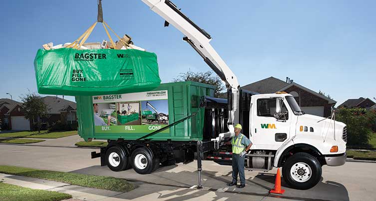 Bagster dumpster bag being lifted onto a WM service truck